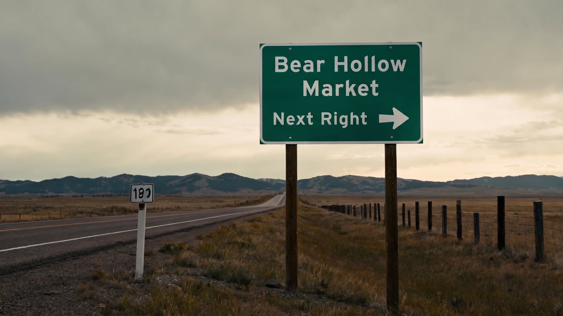 A green highway guide sign on the Colorado plains pointing to a market at the next right