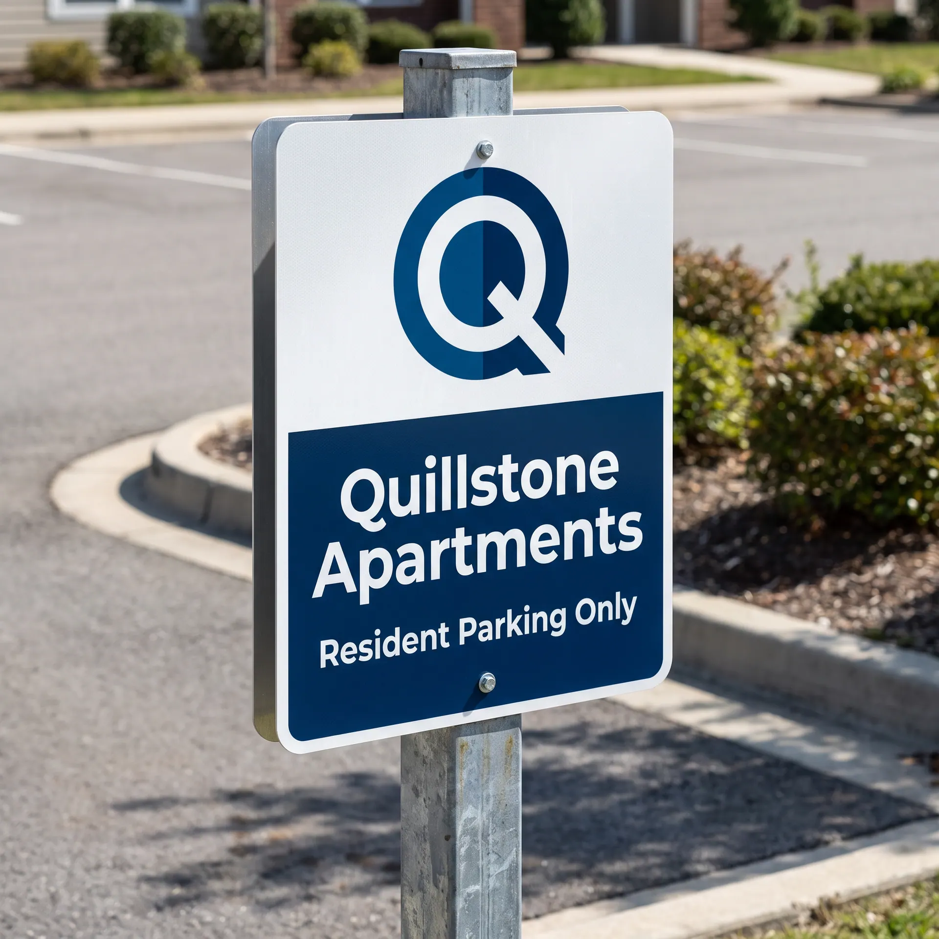 18 x 24 inch reflective aluminium property sign bolted to a square galvanised post, shown with a sample design: at the edge of an apartment community parking lot